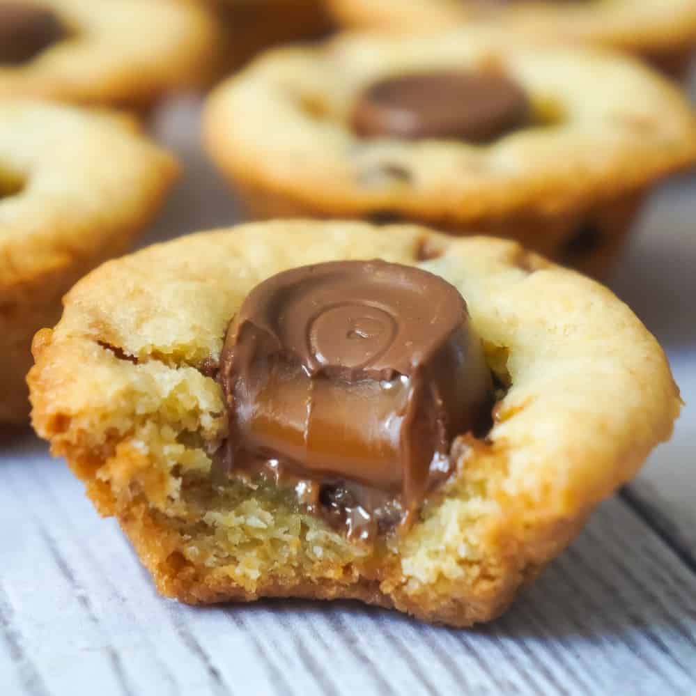 Rolo Sugar Cookie Cups are an easy dessert recipe using Betty Crocker Sugar Cookie Mix. These delicious cookies are baked in mini muffin tins and loaded with Skor bits, mini chocolate chips and Rolo chocolates.
