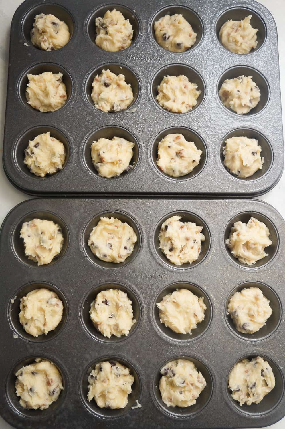 unbaked sugar cookie dough in mini muffin tins