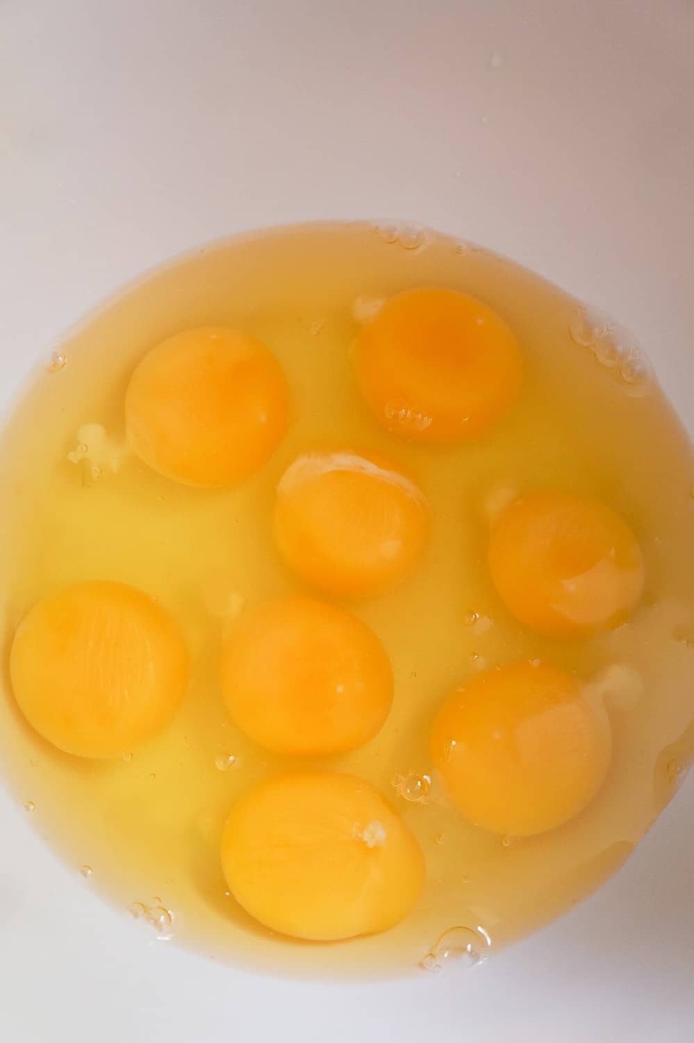 cracked eggs in a mixing bowl