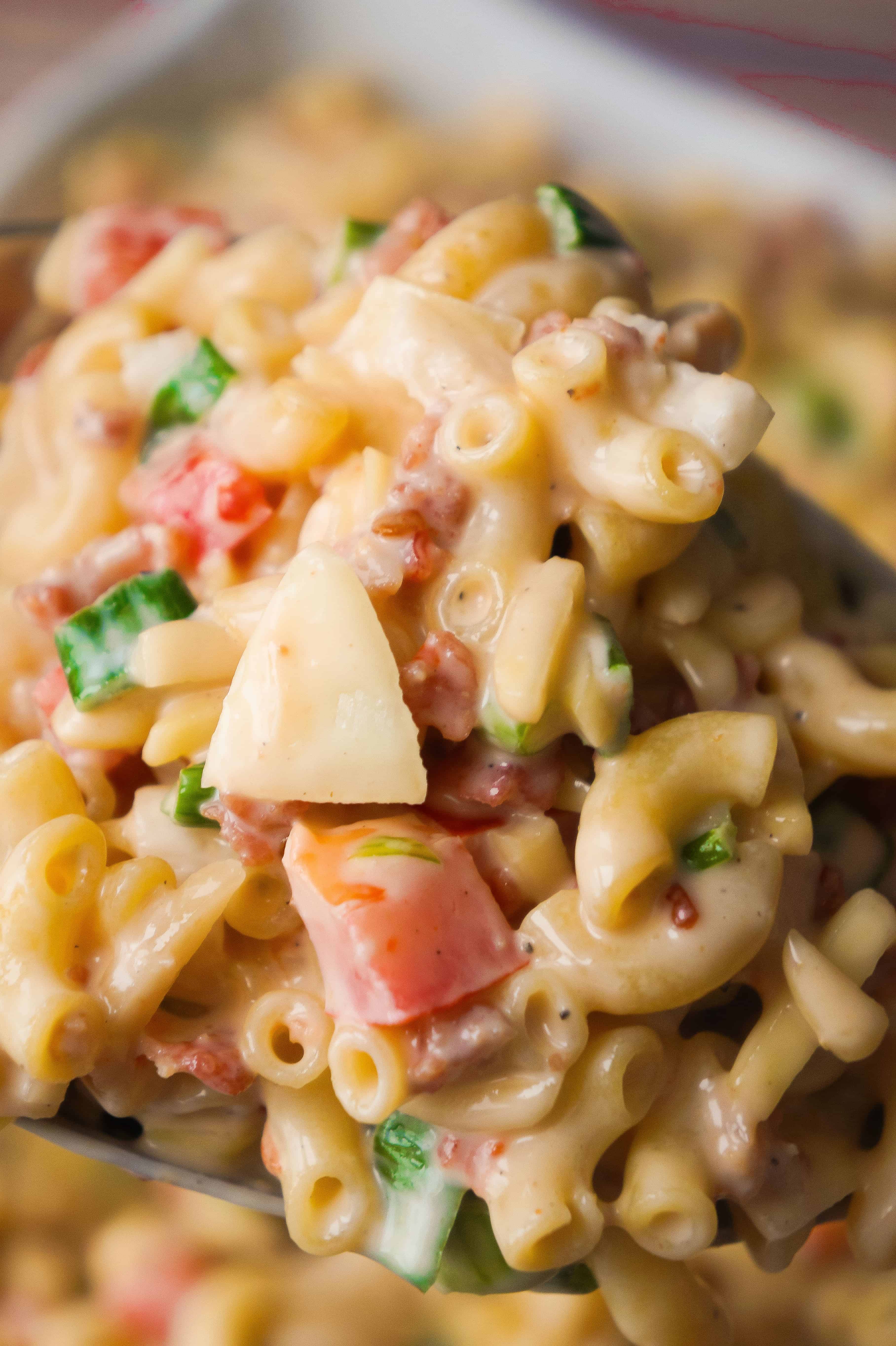 Sweet Chili Bacon Pasta Salad is the perfect side dish for potluck parties. This cold macaroni salad loaded with bacon, red peppers and green onions is tossed in a sweet and spicy sauce. This is an easy BBQ side dish recipe.