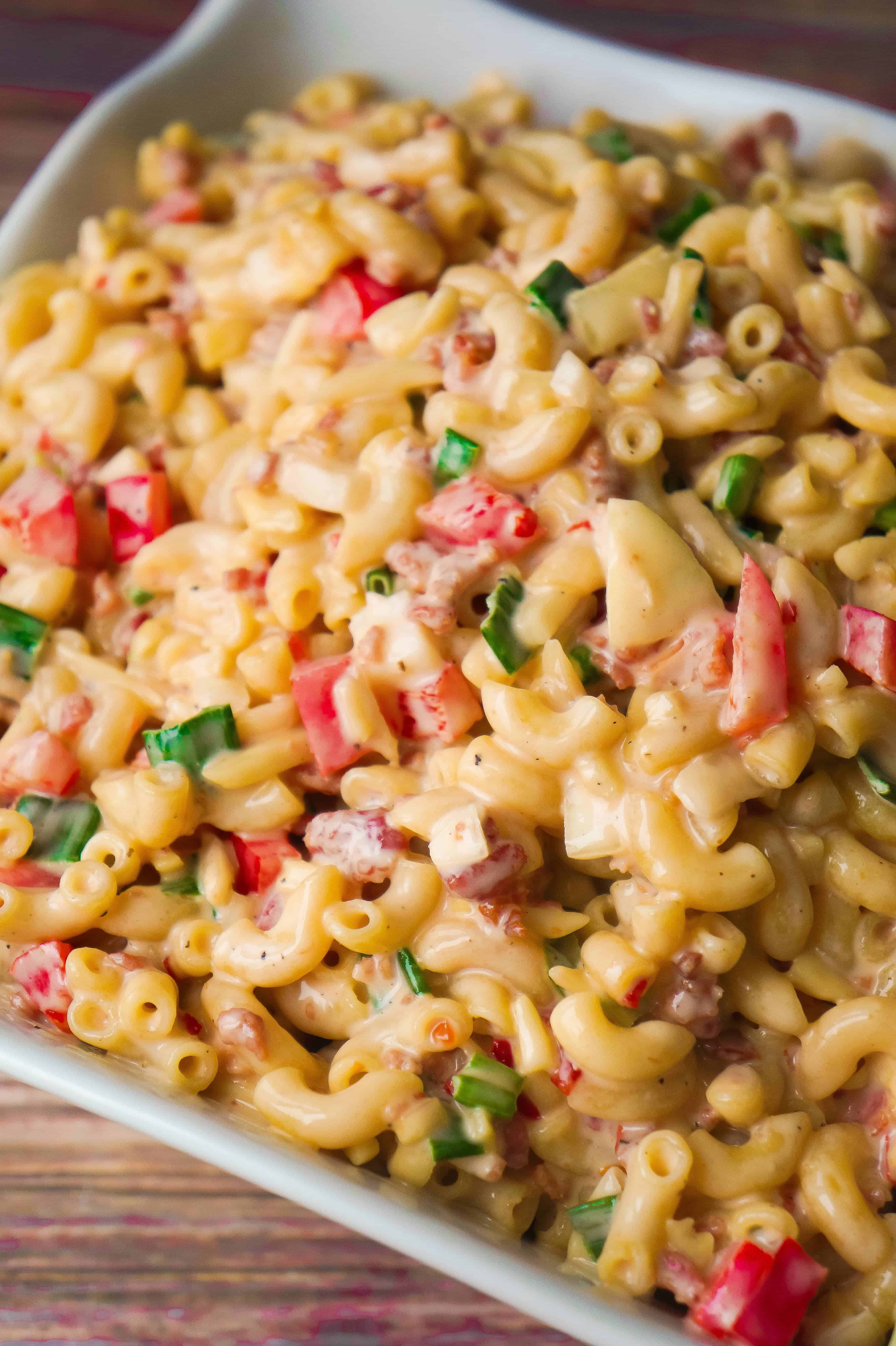 Sweet Chili Bacon Pasta Salad is the perfect side dish for potluck parties. This cold macaroni salad loaded with bacon, red peppers and green onions is tossed in a sweet and spicy sauce. This is an easy BBQ side dish recipe.
