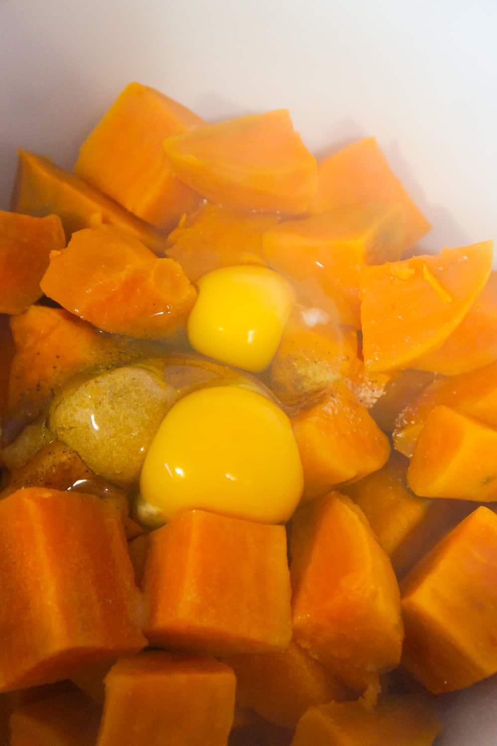 eggs on top of cooked sweet potato chunks