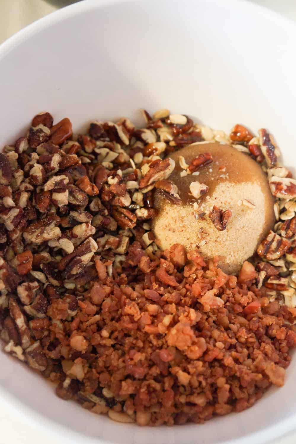 pecan pieces, bacon bits, brown sugar and melted butter in a mixing bowl