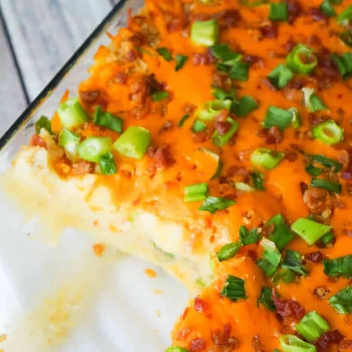 Loaded Mashed Potato Casserole is a hearty side dish recipe perfect for holiday dinners. This mashed potato casserole is loaded with cheddar cheese, bacon, onions and crushed Ritz crackers.