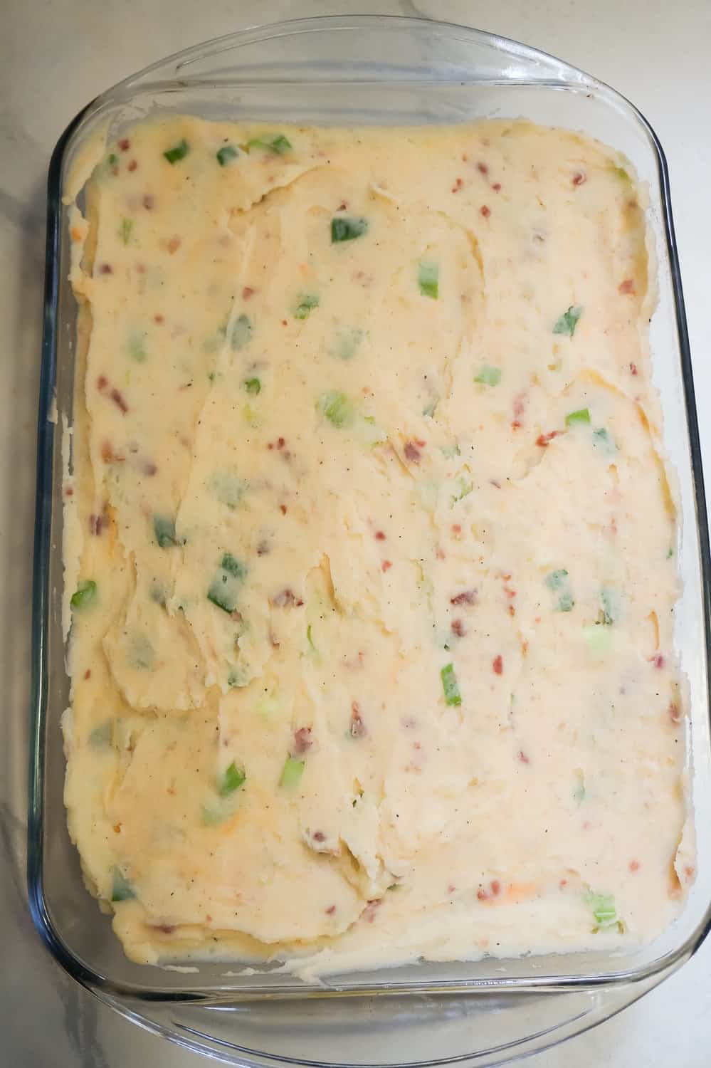 loaded mashed potatoes in a 9 x 13 inch baking dish
