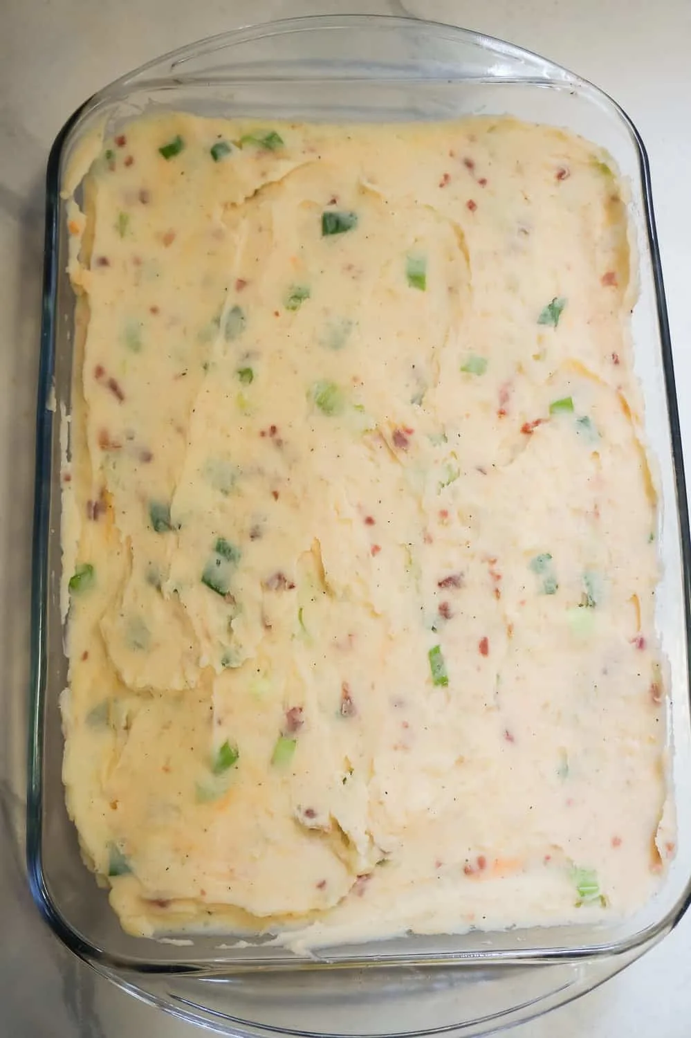 loaded mashed potatoes in a 9 x 13 inch baking dish