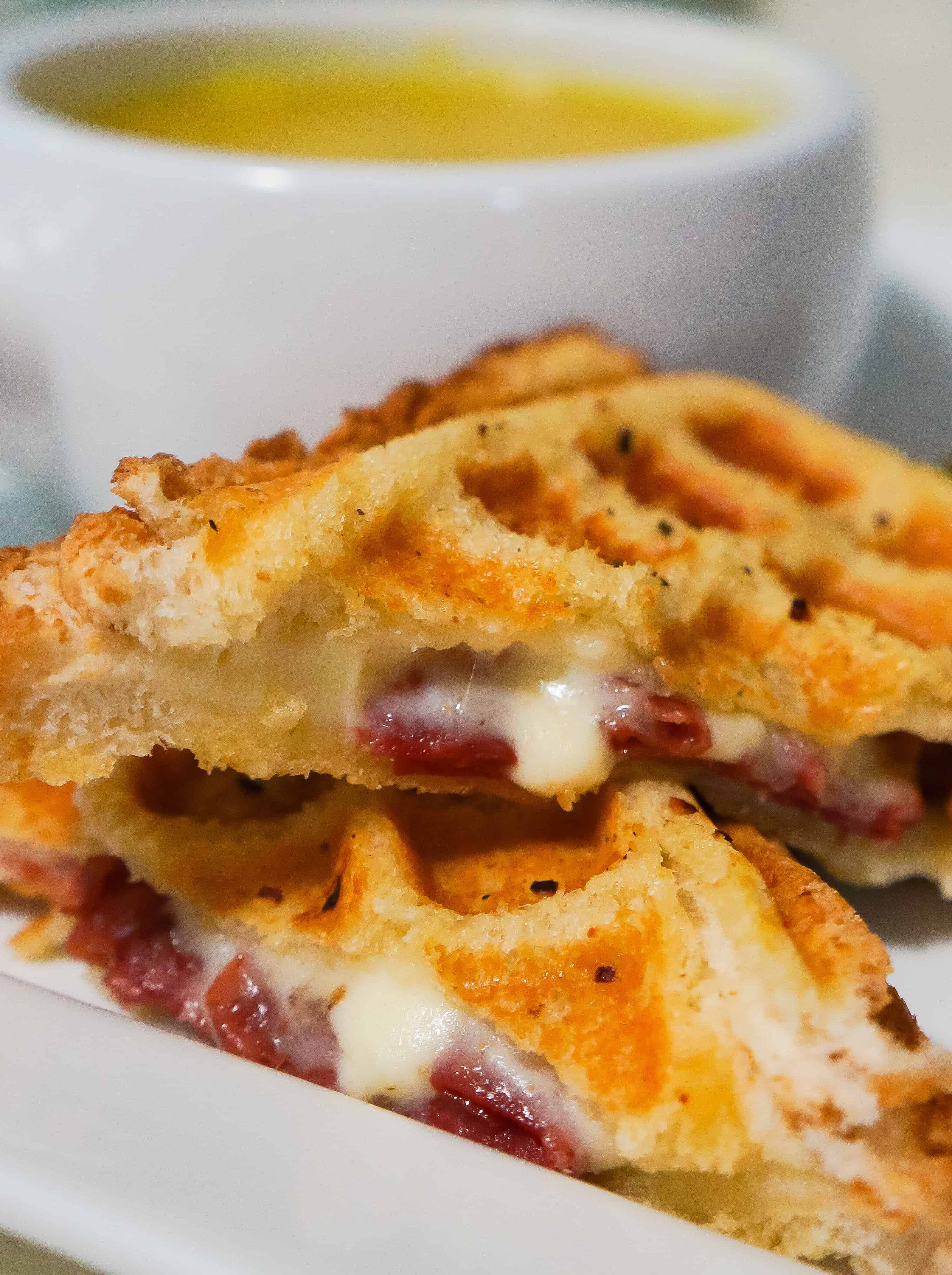 Grilled cheese sandwich with sauteed onions, corned beef and Havarti cheese cooked in a waffle maker. This waffled grilled cheese is perfect for lunch or a quick dinner.