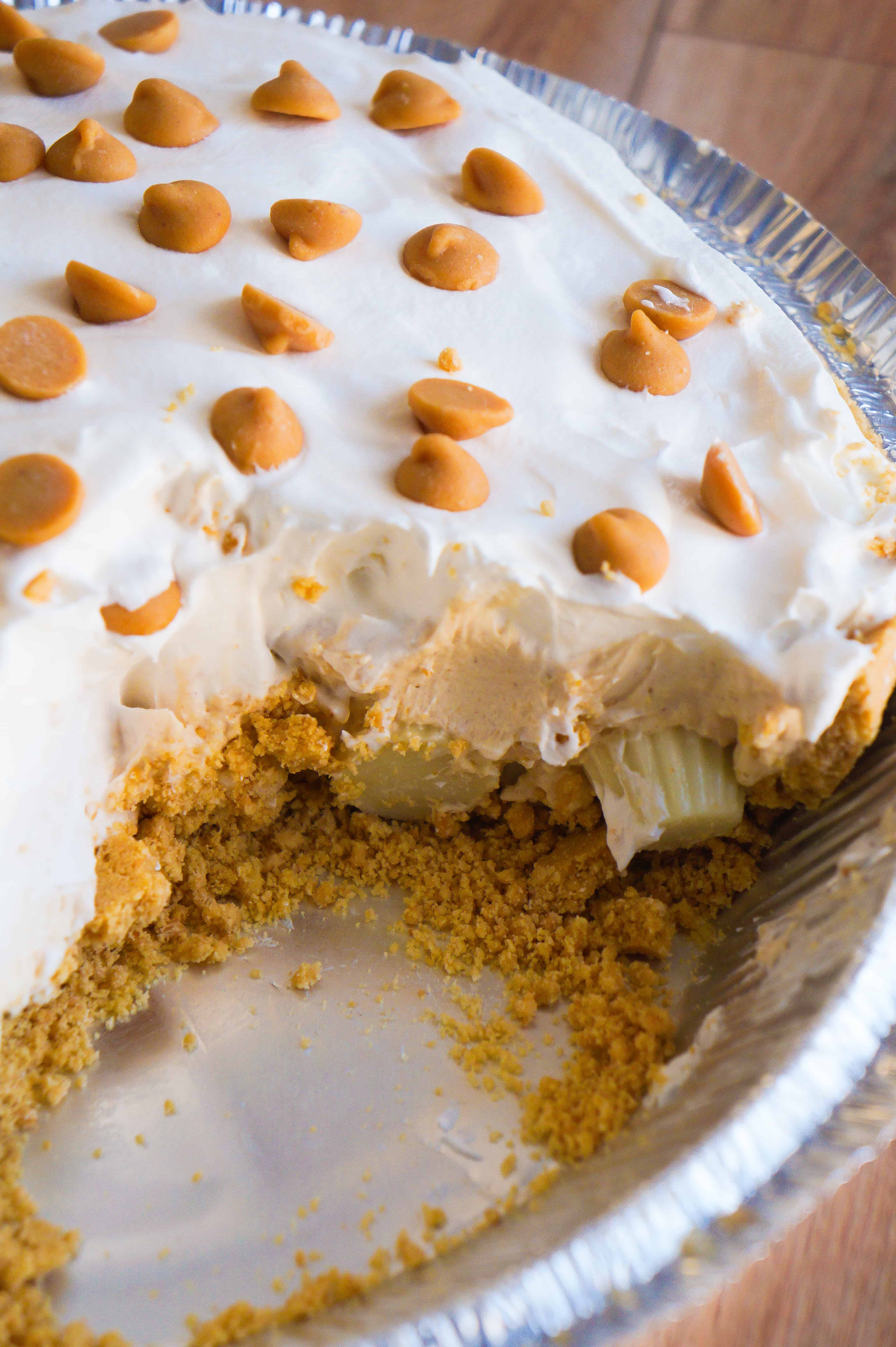 White Chocolate Peanut Butter Pie is an easy no bake dessert recipe. A graham crust is filled with white chocolate pudding and mini Reese's white chocolate peanut butter cups.